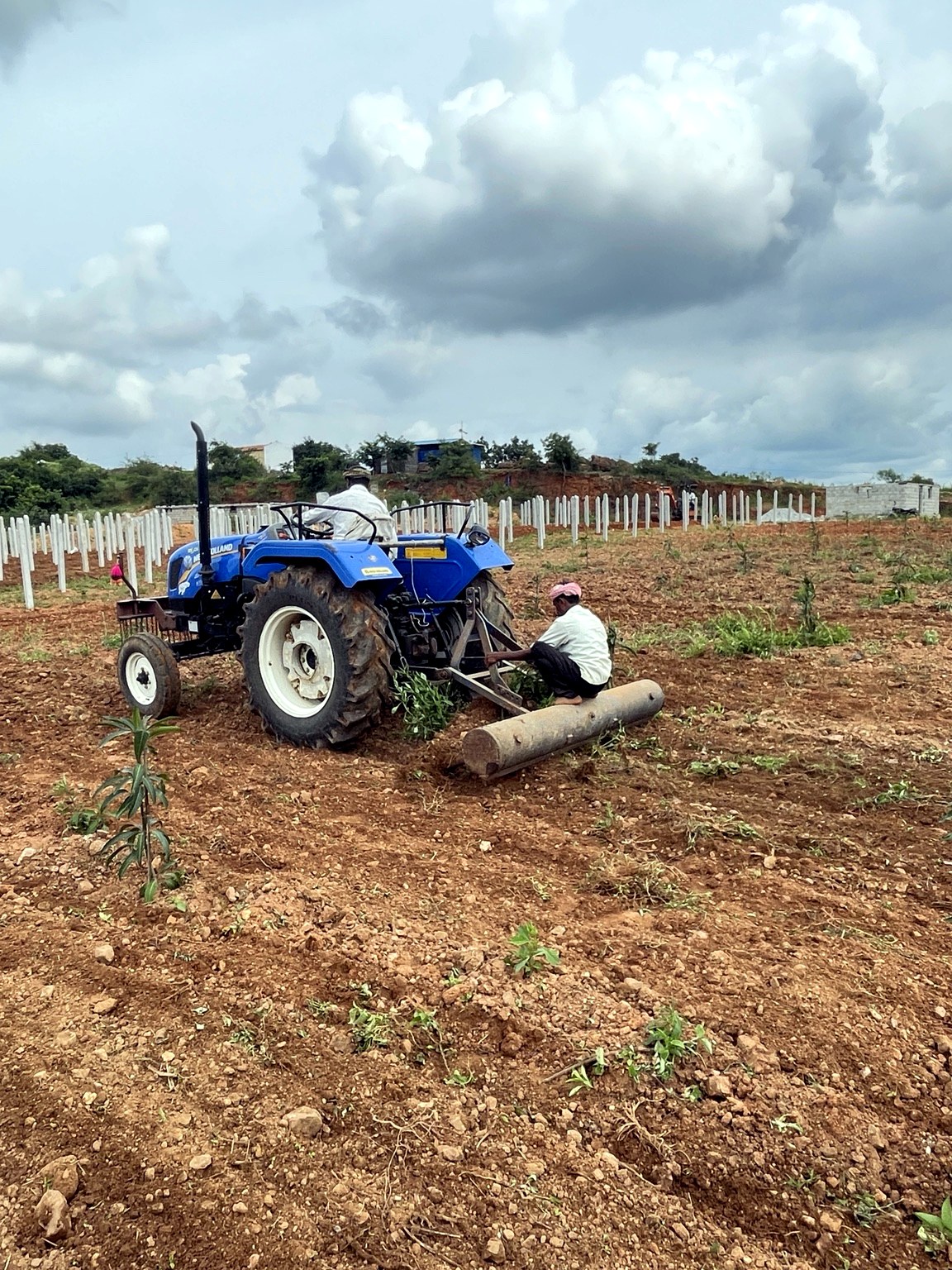 Tractor preparing JD Farms land